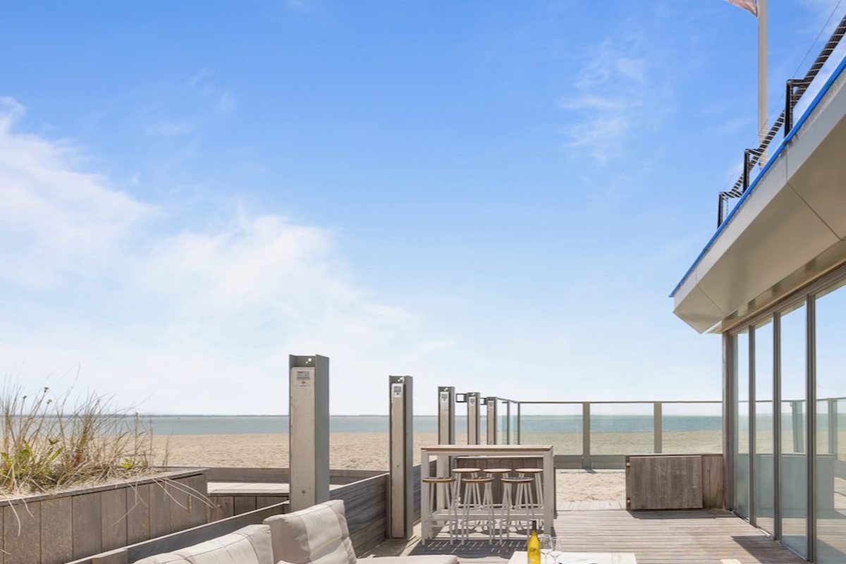 Holiday home terrace overlooking the beach in Zeeland